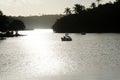 View of the Pituacu park lagoon with tourists using duck-shaped boats. City of Salvador, Bahia