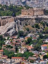 A view of Plaka old neighborhood and Parthenon ancient temple on Acropolis hill. Royalty Free Stock Photo