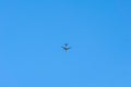 View of plane flying low with blue sky and clouds at background. Airplane fly Royalty Free Stock Photo