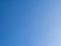 View of plane flying low with blue sky and clouds at background. Airplane fly Royalty Free Stock Photo