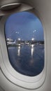 View from the plane to the airport territory in the evening, rainy weather