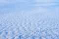 The view from the plane window of dense curly clouds and the blue stratosphere. Cloudscape. Blue sky and white cloud Royalty Free Stock Photo