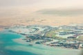 View from a plane window on the resort beach area of the Red Sea. It is visible a part of the desert, lodges of hotels, greens Royalty Free Stock Photo