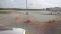 view through plane window to outside with view of plane engine while aircraft parking at airside area in the airport ready to