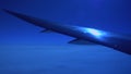 View plane wing from airplane dimmable window, night mode, airplane flying above sky, camera panning slowly down and up, original