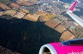 View from plane of Wizz air company on agricultural fields Royalty Free Stock Photo