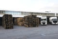 View of plant warehouse: construction, lorries parked, wooden containers stacked