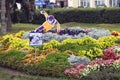 View of plants, flowers and figures in the city park in historical city center of Yaroslavl, Russia.