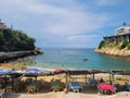 View of Playa Angosta in the traditional part of Acapulco with some palapas