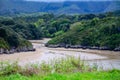 View on Playa de Poo during low tide near Llanes, Green coast of Asturias, North Spain with sandy beaches, cliffs, hidden caves,