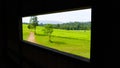 View point of meadow looking pass windows of cottage. Royalty Free Stock Photo