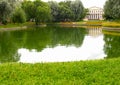 View of a pond and the former Yusupov Palace in the Yusupov garden. St. Petersburg