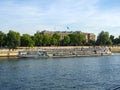 View on Pont de la Concorde and long cruise ship on Seine river in Paris in France