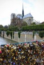 View from the Pont des Arts bridge with locks of love to the Notre Dame cathedral Royalty Free Stock Photo