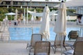 View pool bed, beach chair with umbrellas chaise lounges near the pool