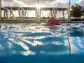 View of a pool surface with back of girl`s head