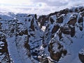 View of popular canyon FjaÃÂ°rÃÂ¡rgljÃÂºfur in southern Iceland with snow-covered rocks, steep cliffs and winding FjaÃÂ°rÃÂ¡ river.