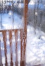 View of porch of rural house through the window glass and visible water droplets on it