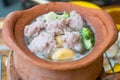 View of pork meat with chopsticks over hot pot and vegetables for shabu.Asian food concept.Slective focus Royalty Free Stock Photo