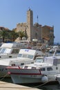 View on port on Adriatic Sea, moored boats and old citadel, island Vis, Komiza, Croatia