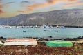 View of port, boats on the shore and volcanic Lanzarote Island in the background, Caleta del Sebo, La Graciosa, Spain