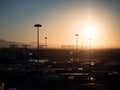 View of the port with containers awaiting shipment at sunset