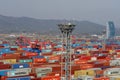 View of the port of Kwangyang , South Korea full of containers in terminal with mountain in background during rainy weather. Royalty Free Stock Photo