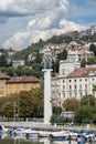 View of port and moored boats and Monument of Liberation on the coast, Rijeka, Croatia