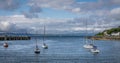 A view of a port with various ships and boats in Mallaig