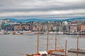 View of the port, wharf with steamships, yachts, boats and sailboats and coastal areas of one northern European city, sum