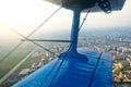 View in the porthole airplane of a turboprop aircraft biplane on the city streets and houses. Royalty Free Stock Photo