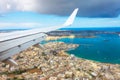 View from the porthole of a passenger plane on the coast of Malta with typical houses Royalty Free Stock Photo