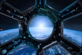 View from a porthole of space station on the Earth background Royalty Free Stock Photo