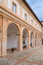 View of the portico and courtyard of the Archbishop`s Palace in the historic city center of Spoleto
