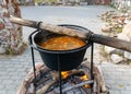 view with pots, cooking festive soup, picnic in nature, historical dishes Royalty Free Stock Photo