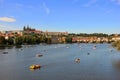 View of Prague with paddle boats on the Vltava river