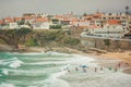 View Of Praia das Macas with group of surfers. Portugal