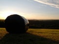 View of the preseli mountains at dusk with hay bal Royalty Free Stock Photo