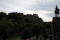 View from Princes street to old town and castle in Edinburgh city, view on houses, hills and trees in old part of the city, Royalty Free Stock Photo
