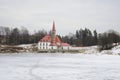 View of Priory Palace on the Black lake on a cloudy afternoon. Gatchina