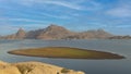 View of pristine landscape of Jawai Dam with hills and clouds