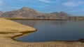 View of pristine landscape of Jawai Dam with hills and clouds