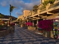 View of promenade with shops in front of famous Hotel Paradise Lago Taurito in the south of Gran Canaria, Spain in the evening.
