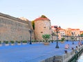 View from the promenade to the city and the city walls in Alghero, Sardinia.