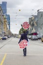 View of a protester holding stop racism now placards outside the Flinders Street Station in Melbourne, Australia