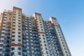 View of public park with newly built modern block of flats under blue sky with few clouds Royalty Free Stock Photo