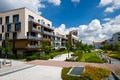 View of public park with newly built modern block of flats