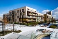 View of public park with newly built modern block of flats