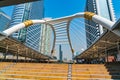 View of public sky walk, tourists and building at Chong Nonsi tr