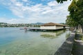 View of the public swimming pool and bath house on Lake Zurich in Rapperswil on a beautiful summer day